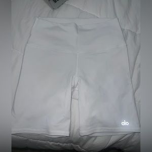 White Alo biker shorts, goes to lower thigh